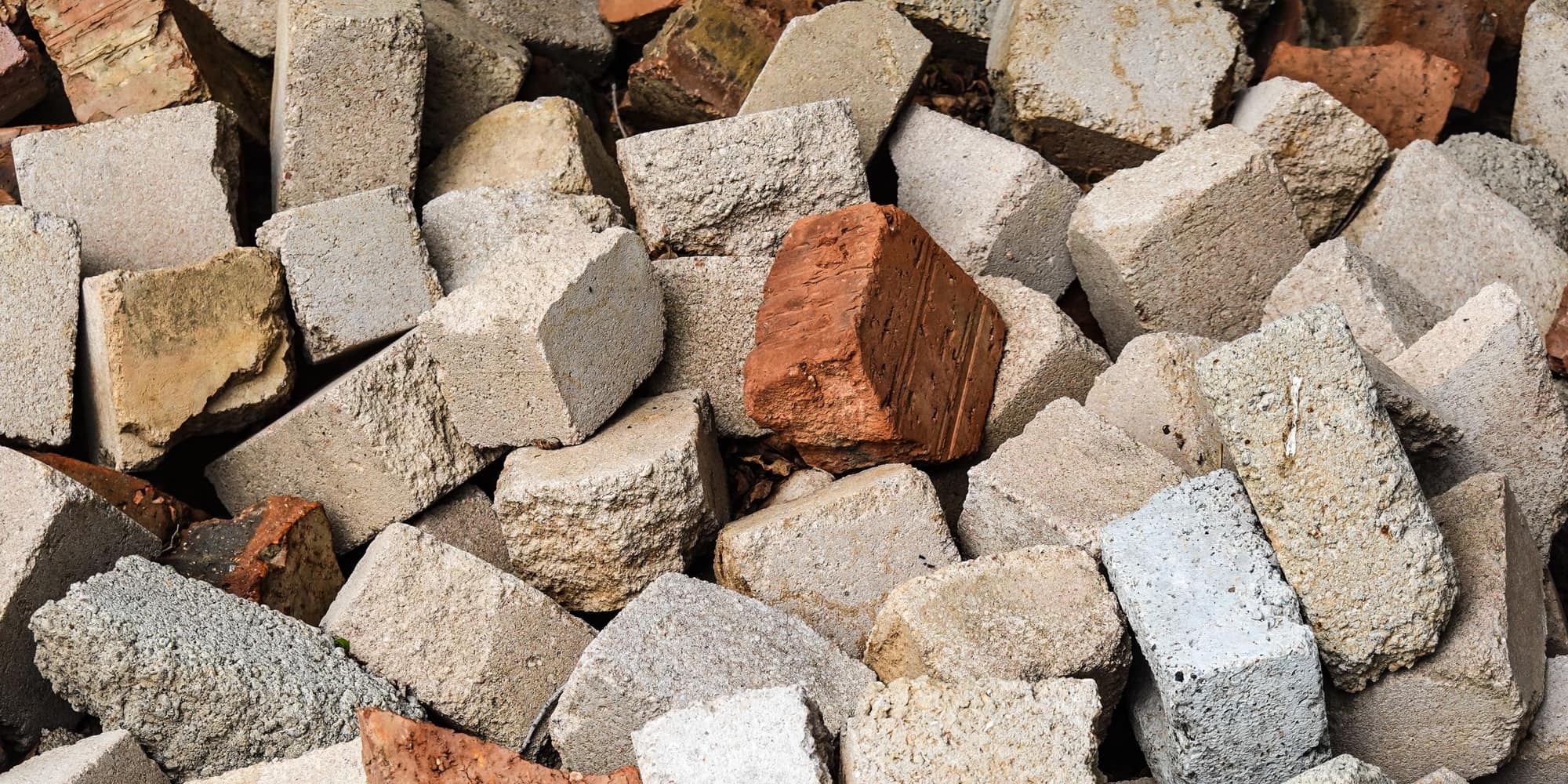 Broken concrete stacked for removal