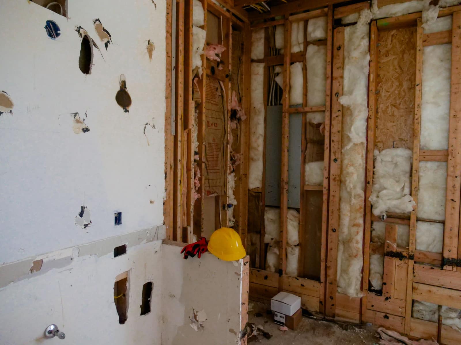 A room stripped back to the studs during an interior demolition